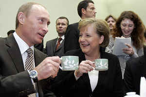 IMAGE: vox7.org Putin, Merkel