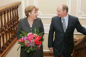 IMAGE: vox7.org Putin, Merkel